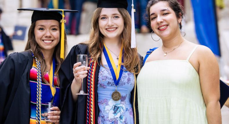 Natalie Hughes (middle) poses with classmates Sierra Garcia and Calista Robledo at graduation.