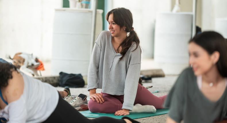 Students taking goat yoga as part of LiveWellSEU