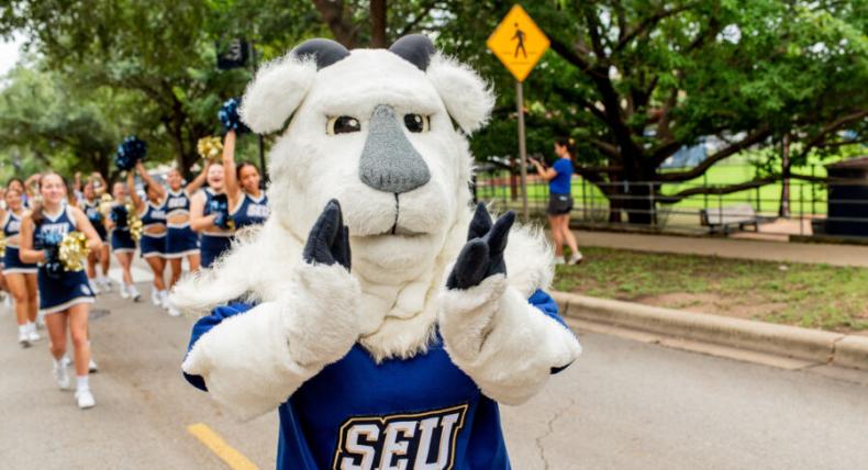 Topper the goat leading the homecoming parade