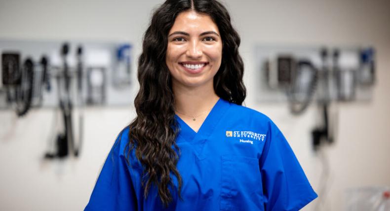 student nurse in blue scrubs