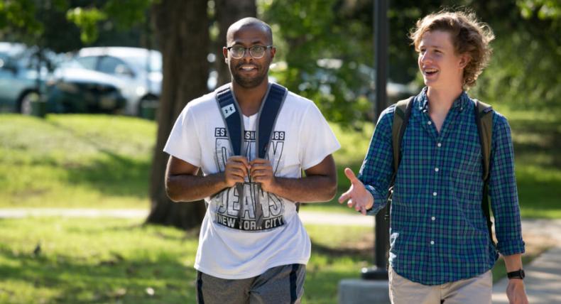 2 students walking around campus