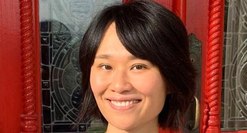 Molly Wang smiles for a picture at the Red Door at St. Edward's.