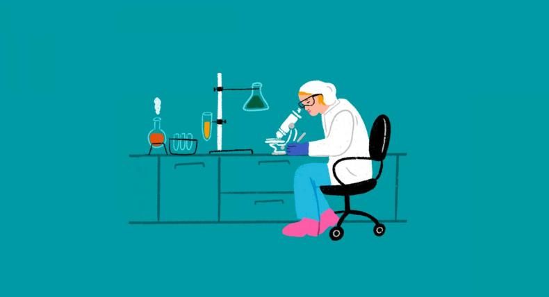 The image is an illustration of a scientist working in a laboratory. The scientist, wearing a white lab coat, glasses, gloves, and a cap, is seated on a black chair and is looking through a microscope placed on a lab bench. The lab bench also has various lab equipment, including test tubes, a flask with a dark green liquid, a beaker with an orange substance emitting steam, and another flask connected to a stand. The background is teal, giving the scene a modern, clean look.