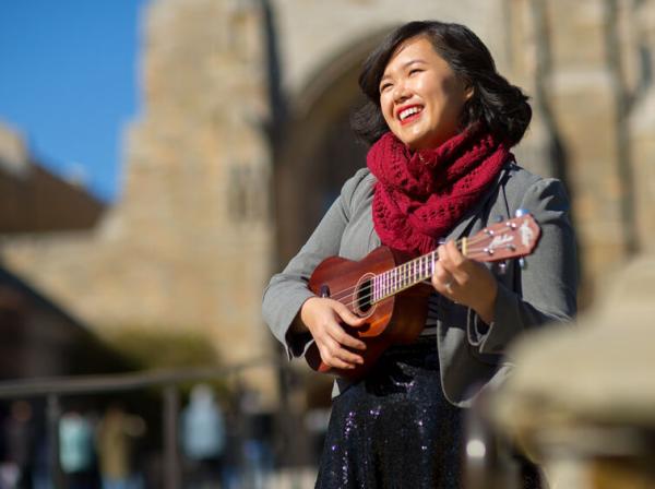 Amy Ontai plays the ukulele outside.