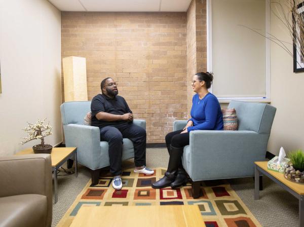 Counselor and patient chatting during a session