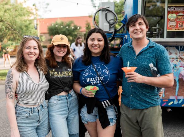 students enjoying a sno cone on campus 