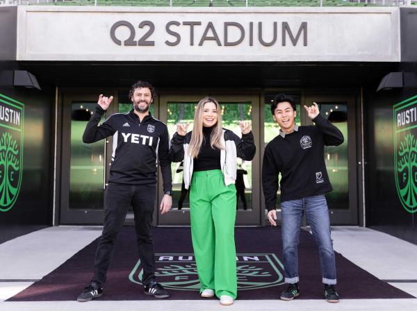 Tony Ho, Alfredo Naim and Emely Alvarado stand together outside of Q2 Stadium in Austin, Texas