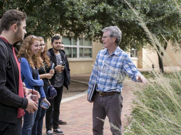 Bill Quinn teaching his students outdoors on campus