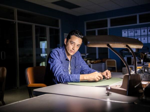 Gabriel Luna sitting at a desk