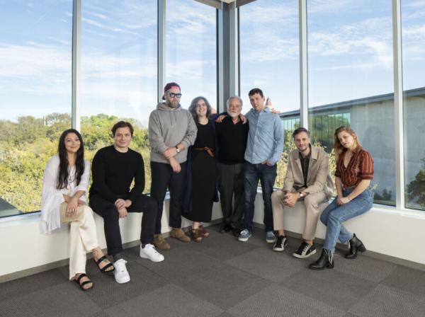 St. Edward's Photocommunications alumni stand together for a portrait.