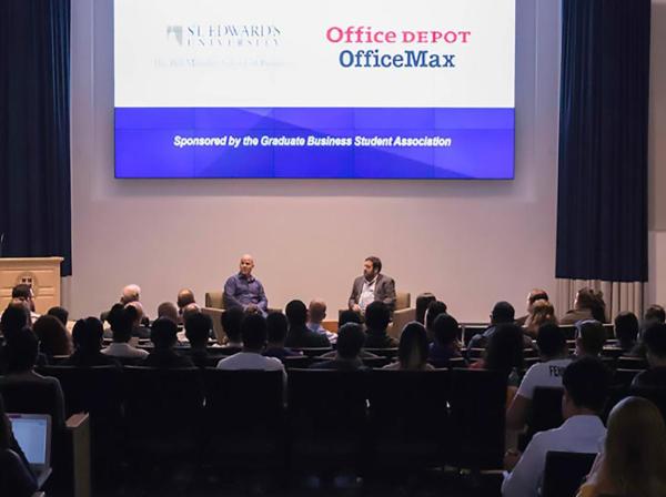 An audience listens to a Munday School of Business fireside chat in Jones Auditorium.