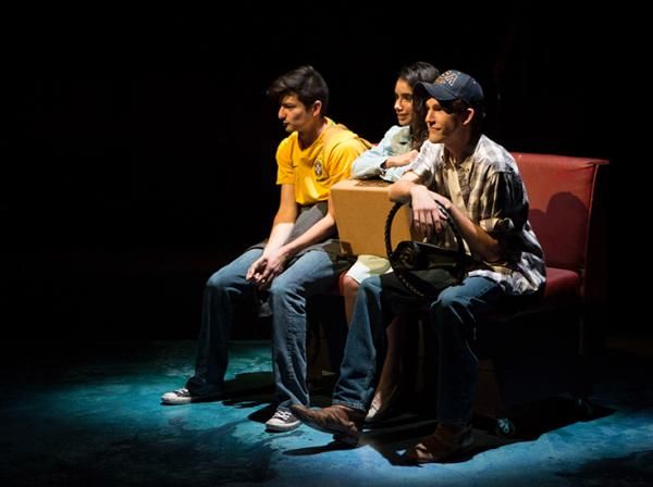 Three students act on the Mary Moody Northen Theatre stage in the play Anon(ymous).