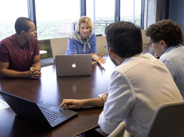 2 students in a downtown conference room during an internship