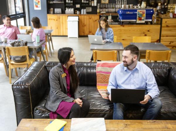 Student and a professor talking in a coffee shop