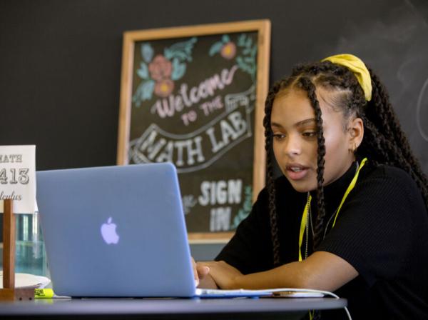 Taylor Huey prepares to mentor students in the Math Lab