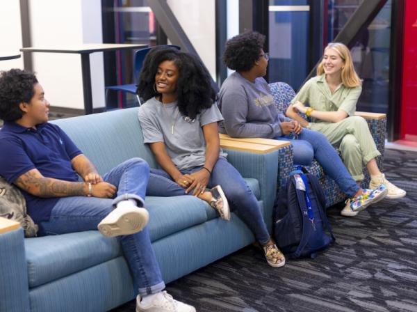 Students at St. Edward's socializing in the lobby of the Residential Village