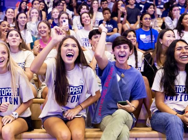 Students cheering during Anchor pep rally at St. Edward's