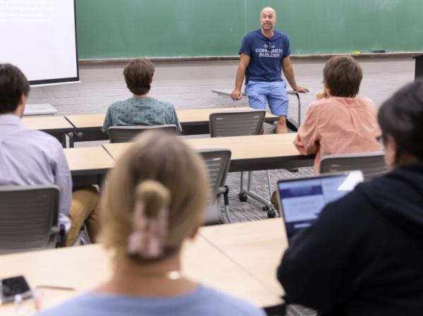 Students at St. Edward's listen intently to a professor leading a classroom discussion. 