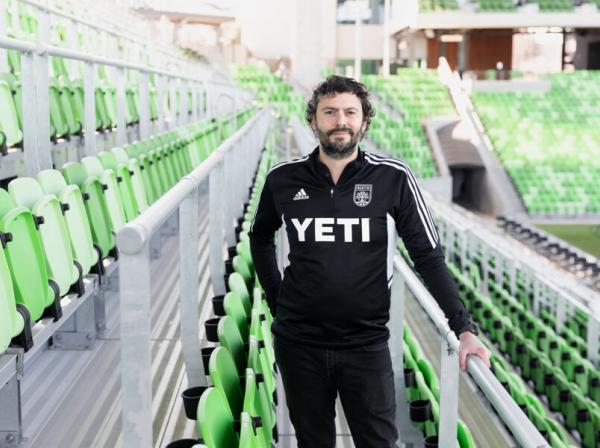 Alfredo Naim '07 smiles for a photo inside Austin FC Stadium.