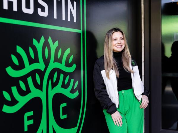 Emely Alvarado '21 poses for a photo in front of Austin FC Stadium.