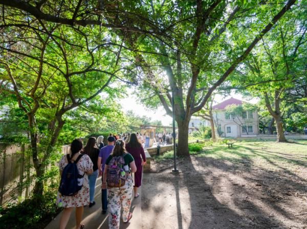 students walking on campus 