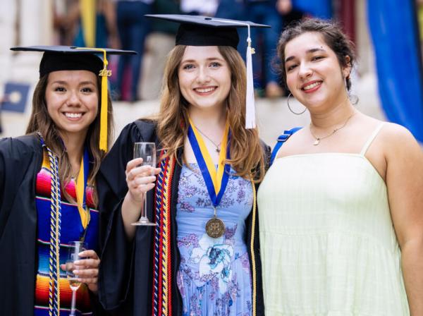 Natalie Hughes (middle) poses with classmates Sierra Garcia and Calista Robledo at graduation.