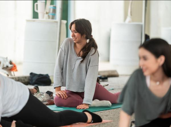 Students taking goat yoga as part of LiveWellSEU