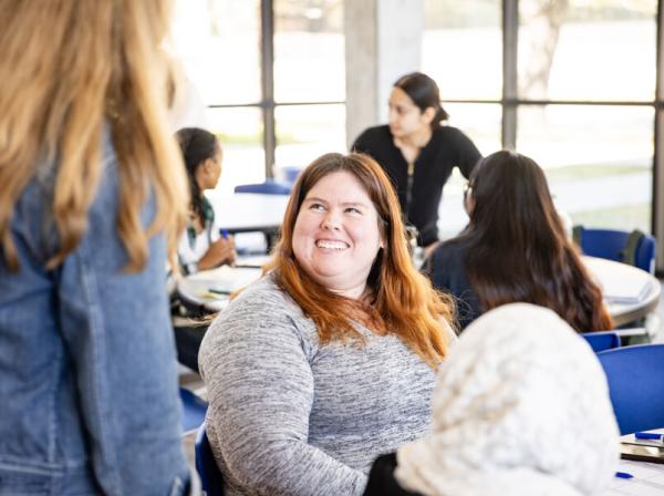 student smiling up at professor