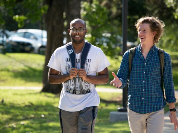 2 students walking around campus