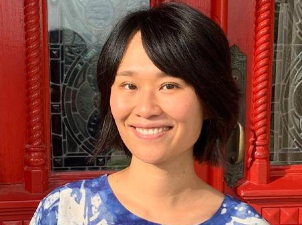 Molly Wang smiles for a picture at the Red Door at St. Edward's.