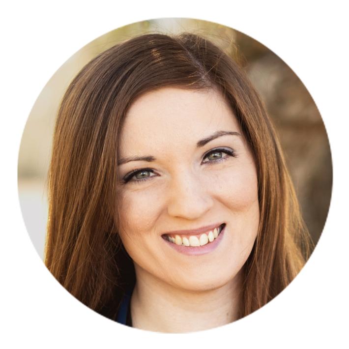 Close-up headshot of a woman with auburn hair