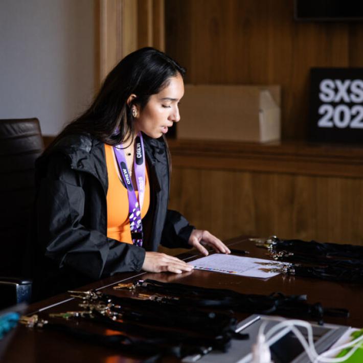 Student, Cressida Rodriguez, looks through work documents for her internship at SXSW