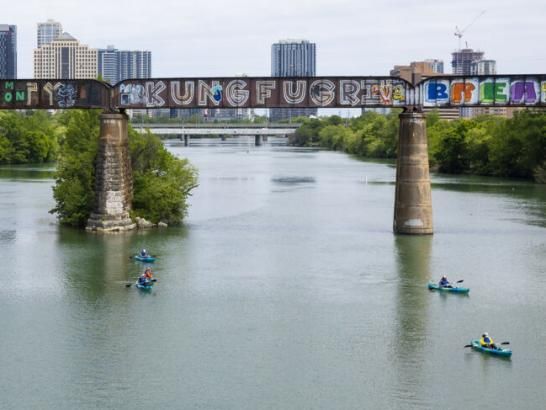 People kayaking down Lady Bird Lake in downtown Austin, Texas.