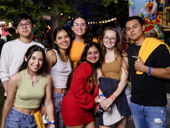 Seven students stand together for a photo at Hillfest.