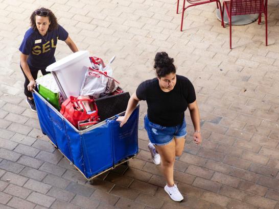 Student moving into their dorm