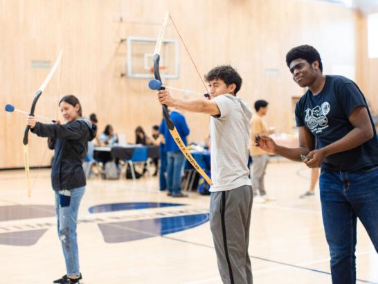 Students participating in an Unwind Before the Grid recreational event before finals