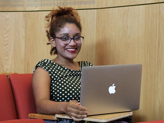 Brianna Collins speaking at a McNair alumni event