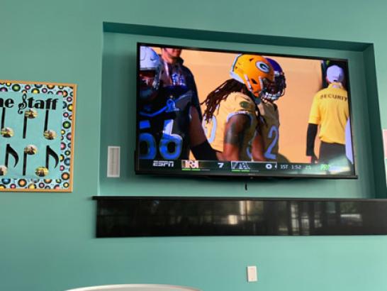 A photo of a TV showing a football game