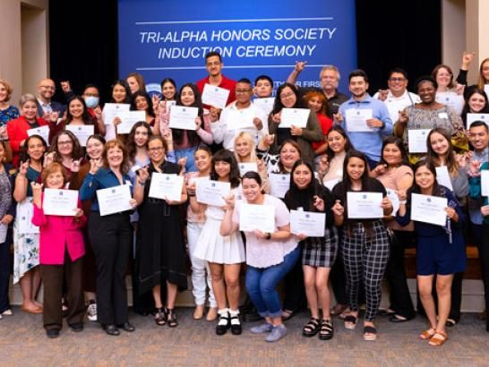 Tri-Alpha students pose during their induction ceremony.