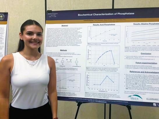 Biochemistry student presents her poster at SOURCE forum on campus