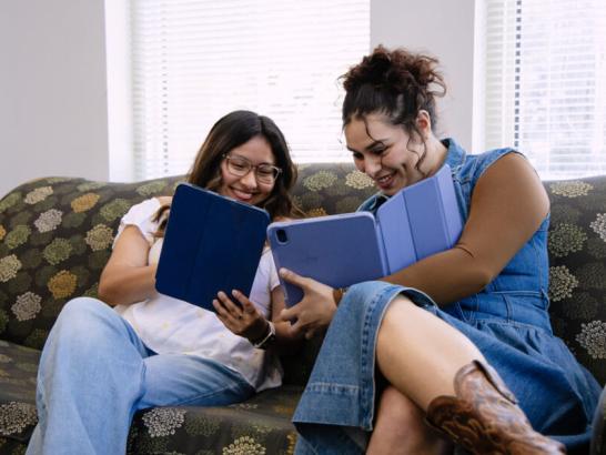 Students helping each other study for a test in the dorm common area