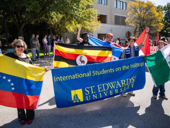 International students celebrating at the Homecoming parade