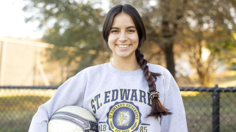 A St. Edward's University student participating in club soccer