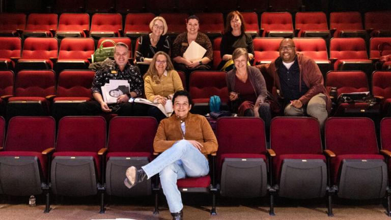 Gabriel Luna sitting with MMNT staff for a photo