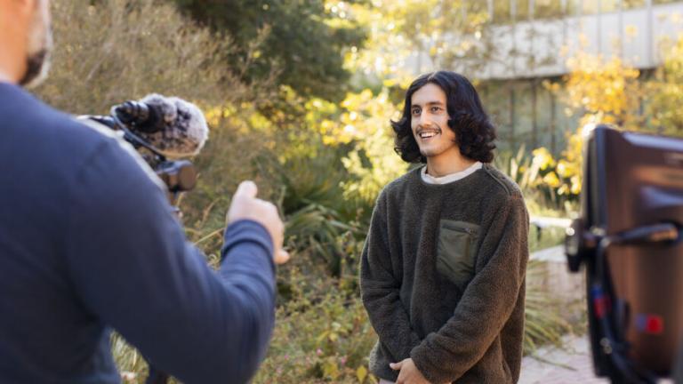 Eduardo "Lalo" Carrillo is in front of the camera for The College Tour episode of St. Edward's University