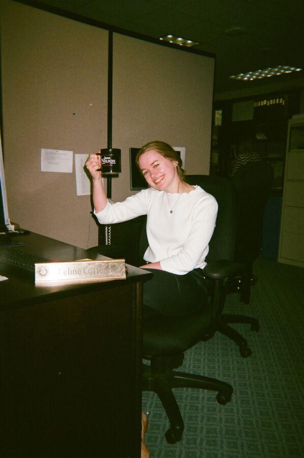 Celine Cottenoir sits at her desk at her Capitol internship.