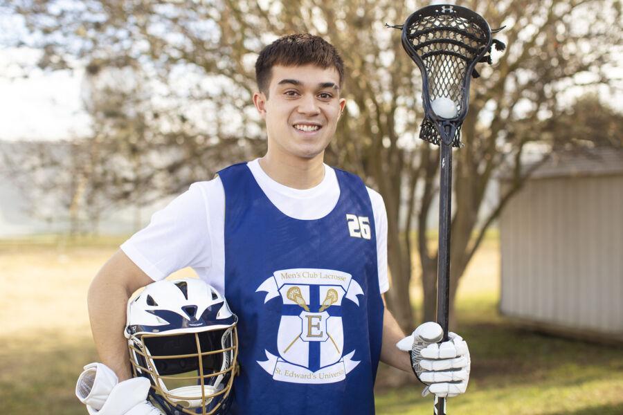 Michael Manimbo in Lacrosse gear holding a Lacrosse stick