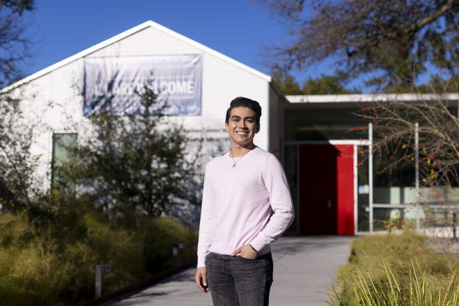 Cristobal Diaz stands in the Campus Ministry Courtyard with the Campus Ministry Building in the background.