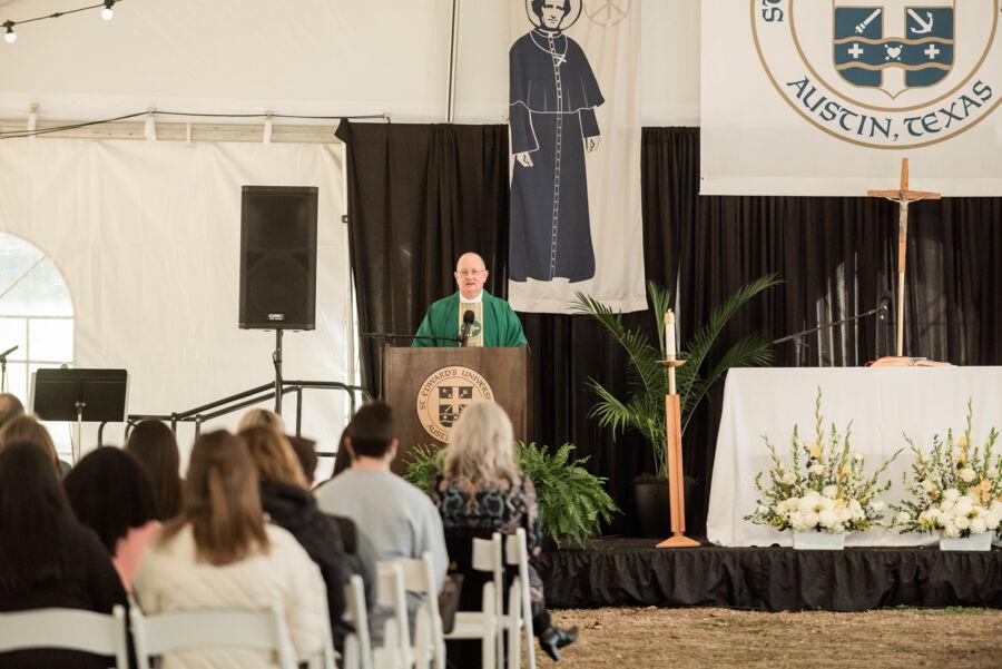 People attend and participate in homecoming mass.