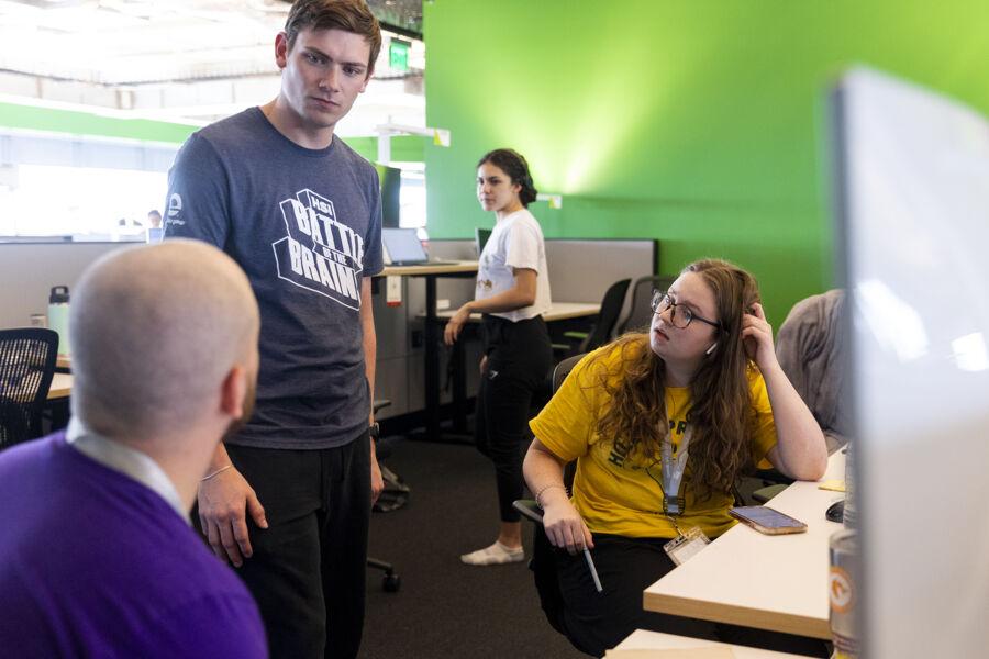 Students talking at the battle of the brains competition 